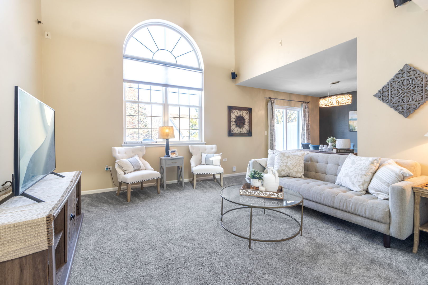 533 Mallard Lane, Unit D Sugar Grove, IL 60554 - Photo 2 of 12 a living room with furniture a flat screen tv and a large window