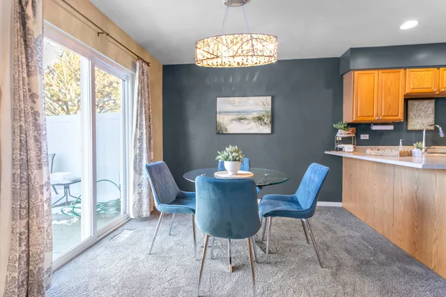 a living room with furniture a flat screen tv and a large window