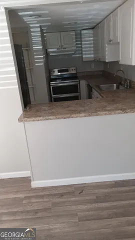 a view of kitchen and microwave