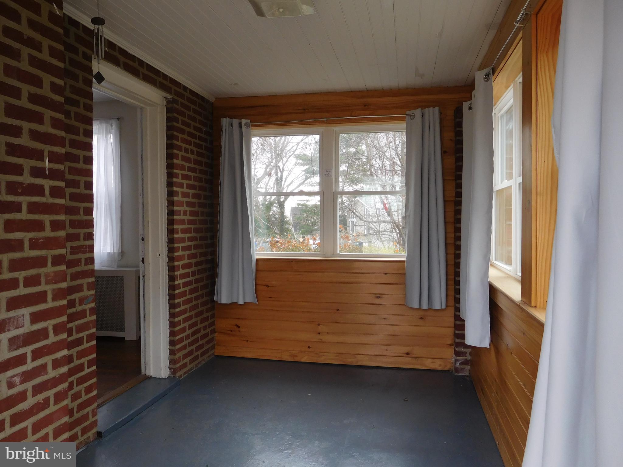1207 Rosedale Avenue Bellefonte, DE 19809 - Photo 19 of 38 Side Porch/Den has brick + wood accents
