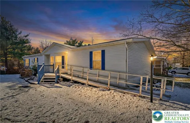 a front view of a house with stairs