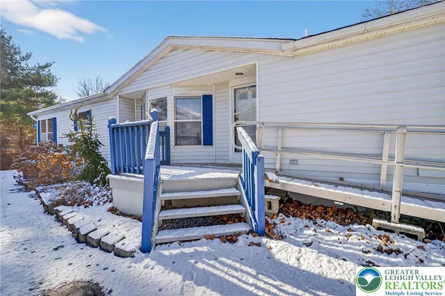 a front view of a house with a porch