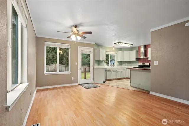 a view of a kitchen with a sink and a window