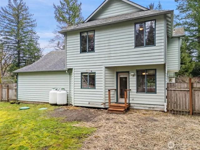 a swimming pool with wooden fence