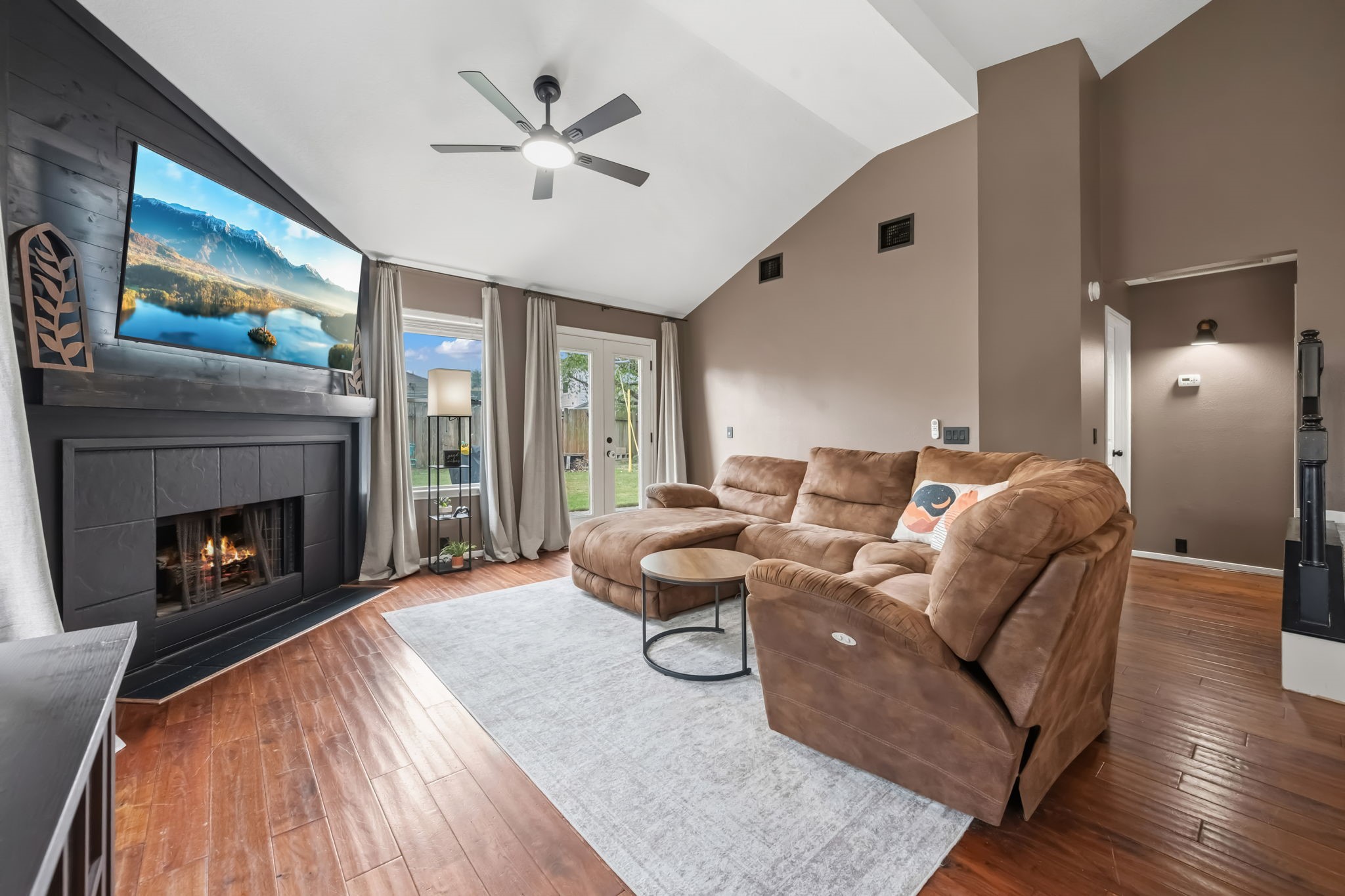 11903 Ezekiel Road Tomball, TX 77375 - Photo 13 of 30 a living room with furniture and a fireplace