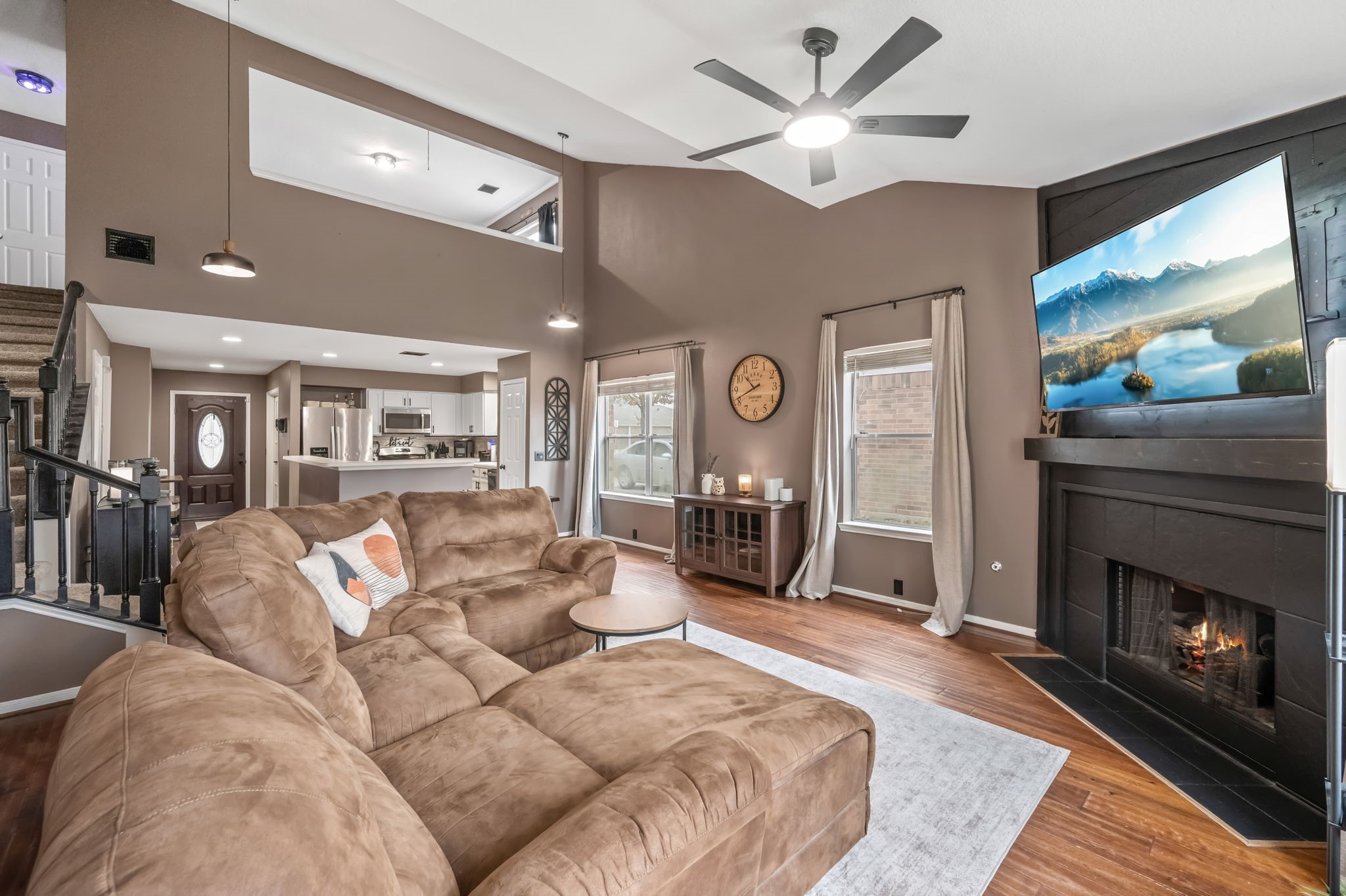 11903 Ezekiel Road Tomball, TX 77375 - Photo 15 of 30 a living room with furniture a large window and a fireplace