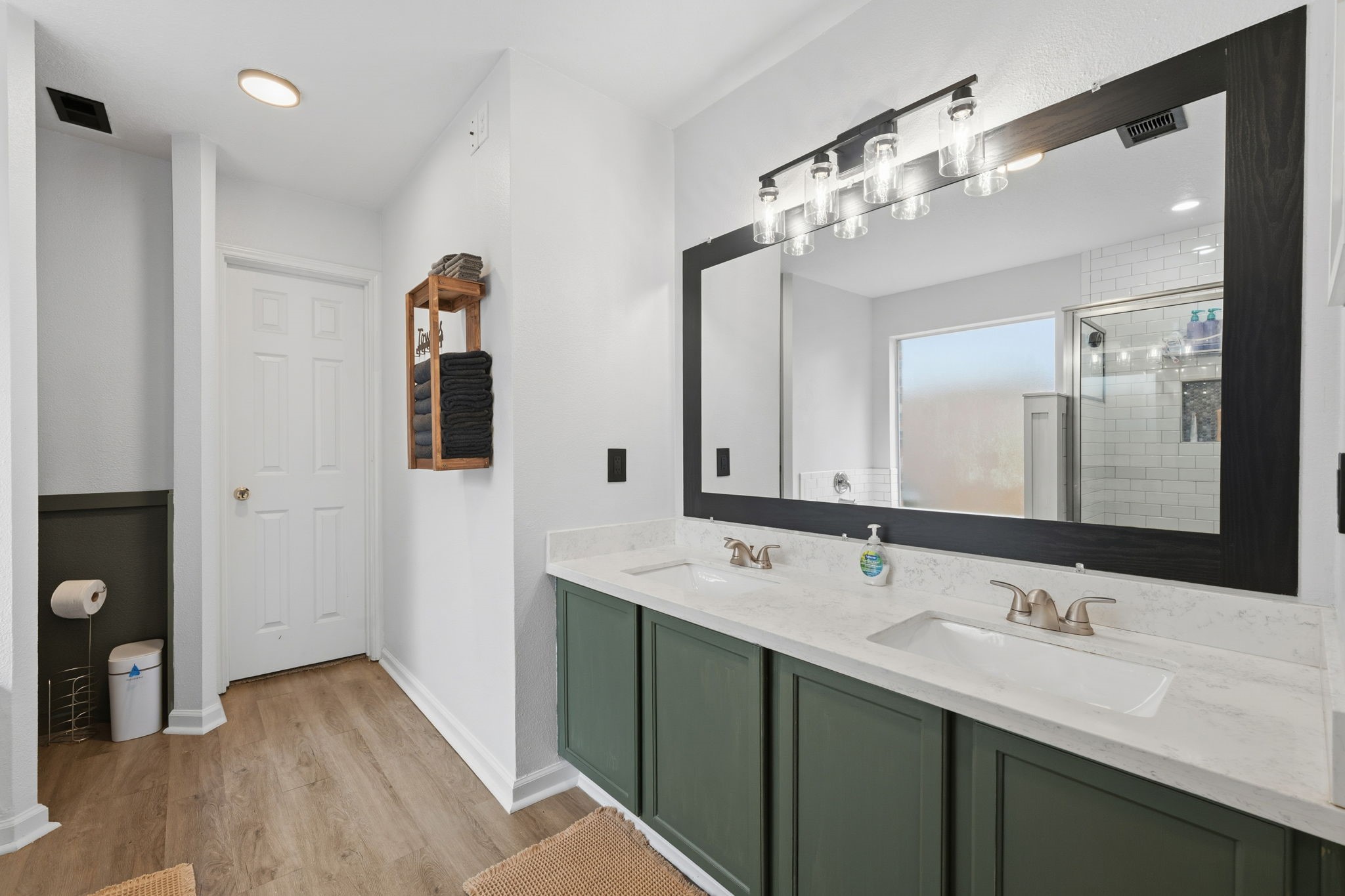 11903 Ezekiel Road Tomball, TX 77375 - Photo 19 of 30 a bathroom with a double vanity sink and mirror