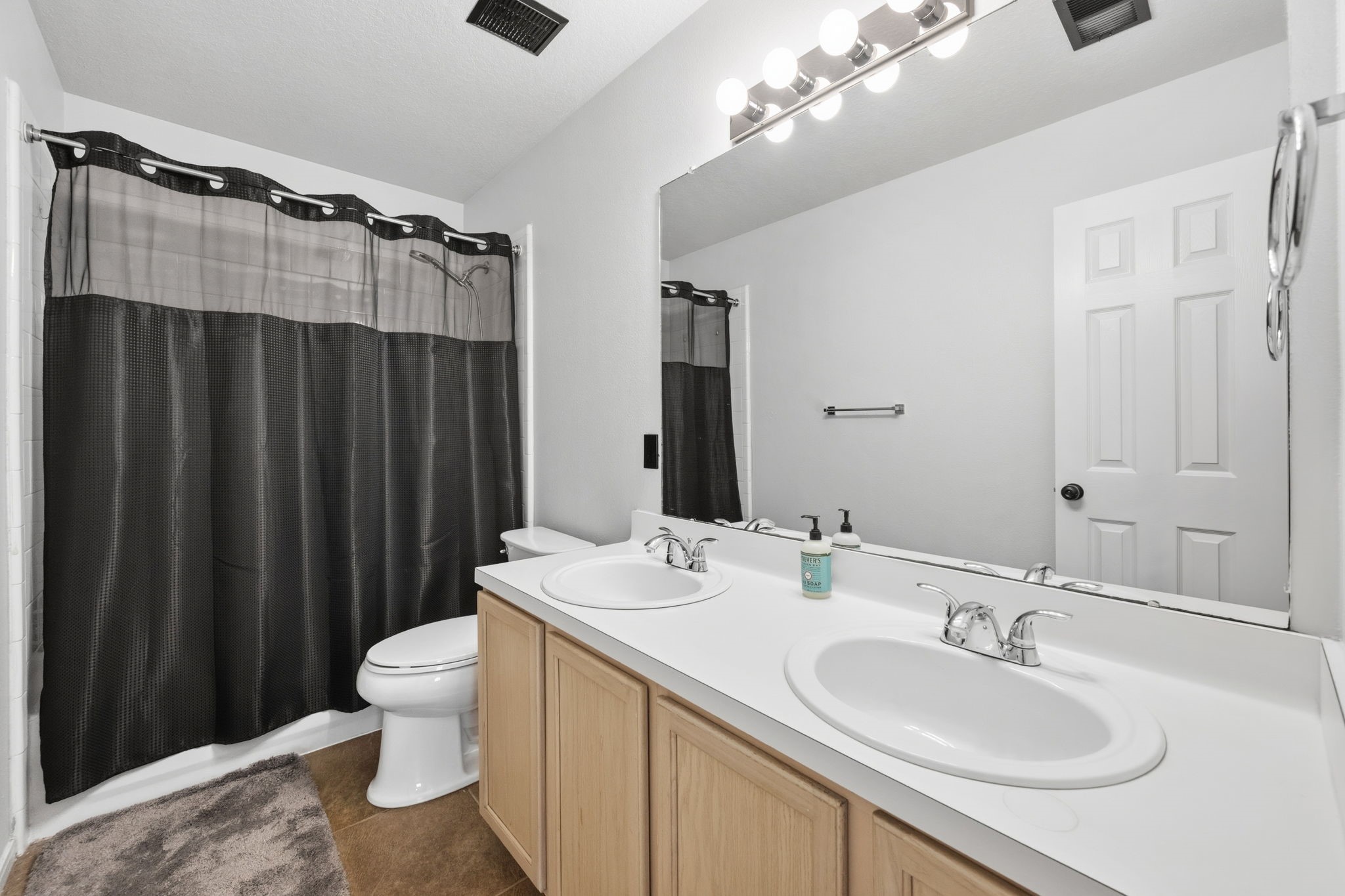 11903 Ezekiel Road Tomball, TX 77375 - Photo 26 of 30 a bathroom with a sink and a mirror