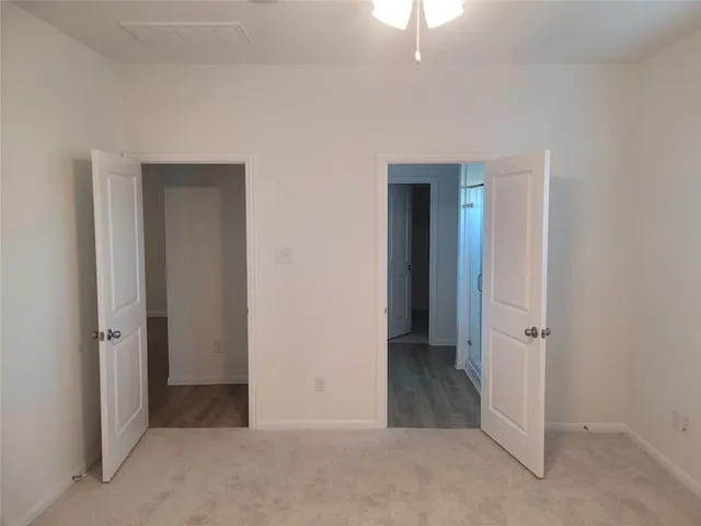 an empty room with a bathroom