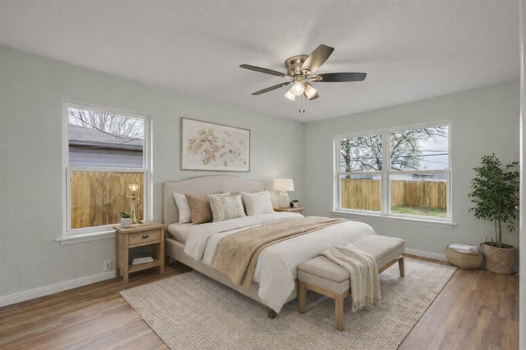 732 Bullock Street Denison, TX 75020 - Photo 12 of 29 a bedroom with a large bed and a window