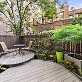 a view of a chair and tables in the patio