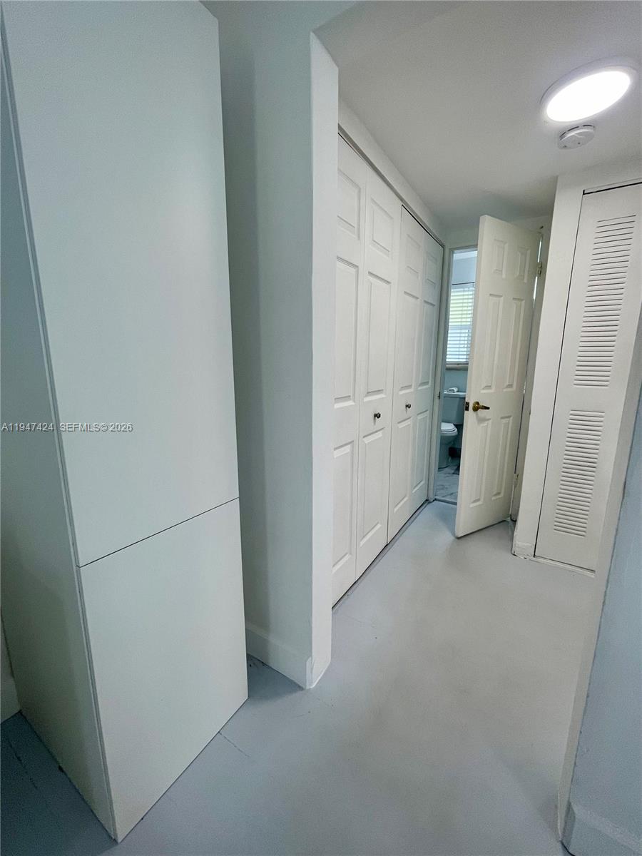 8036 Harding Avenue, Unit 1 Miami Beach, FL 33141 - Photo 15 of 33 a view of a storage & utility room with refrigerator