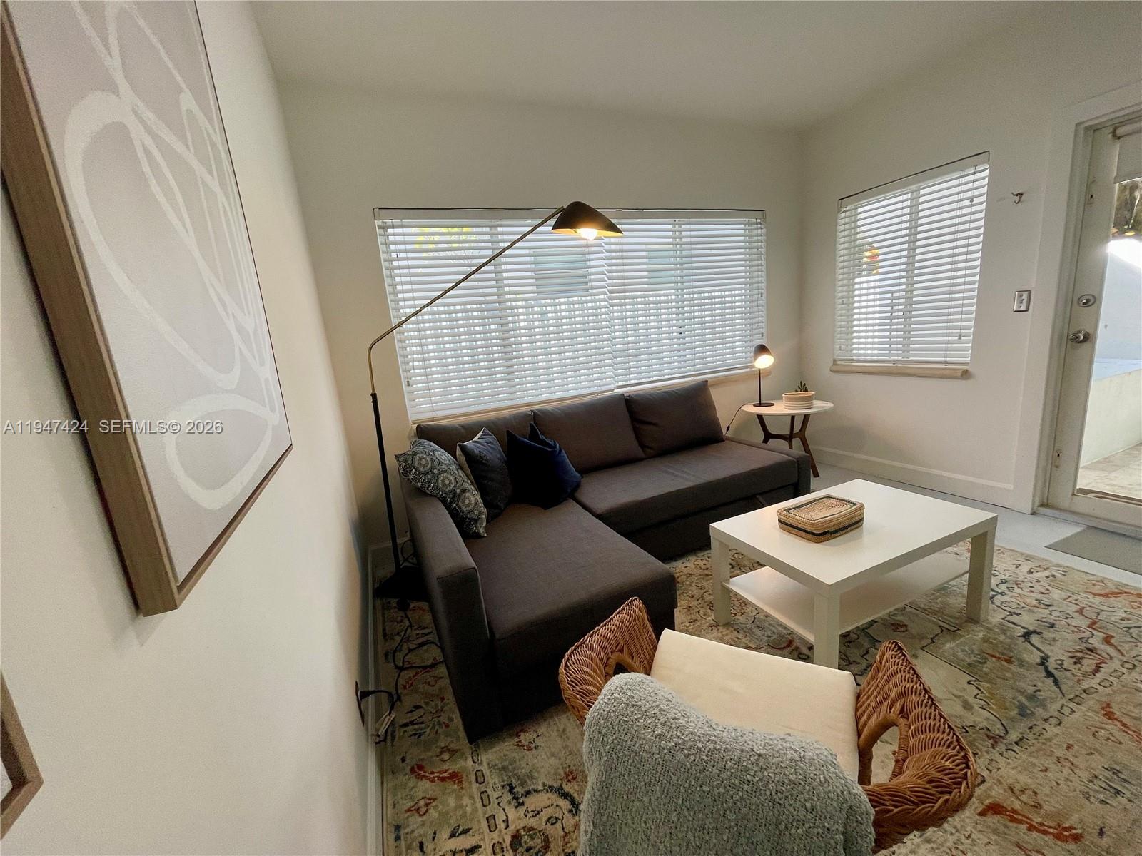 8036 Harding Avenue, Unit 1 Miami Beach, FL 33141 - Photo 23 of 33 a living room with furniture and a window