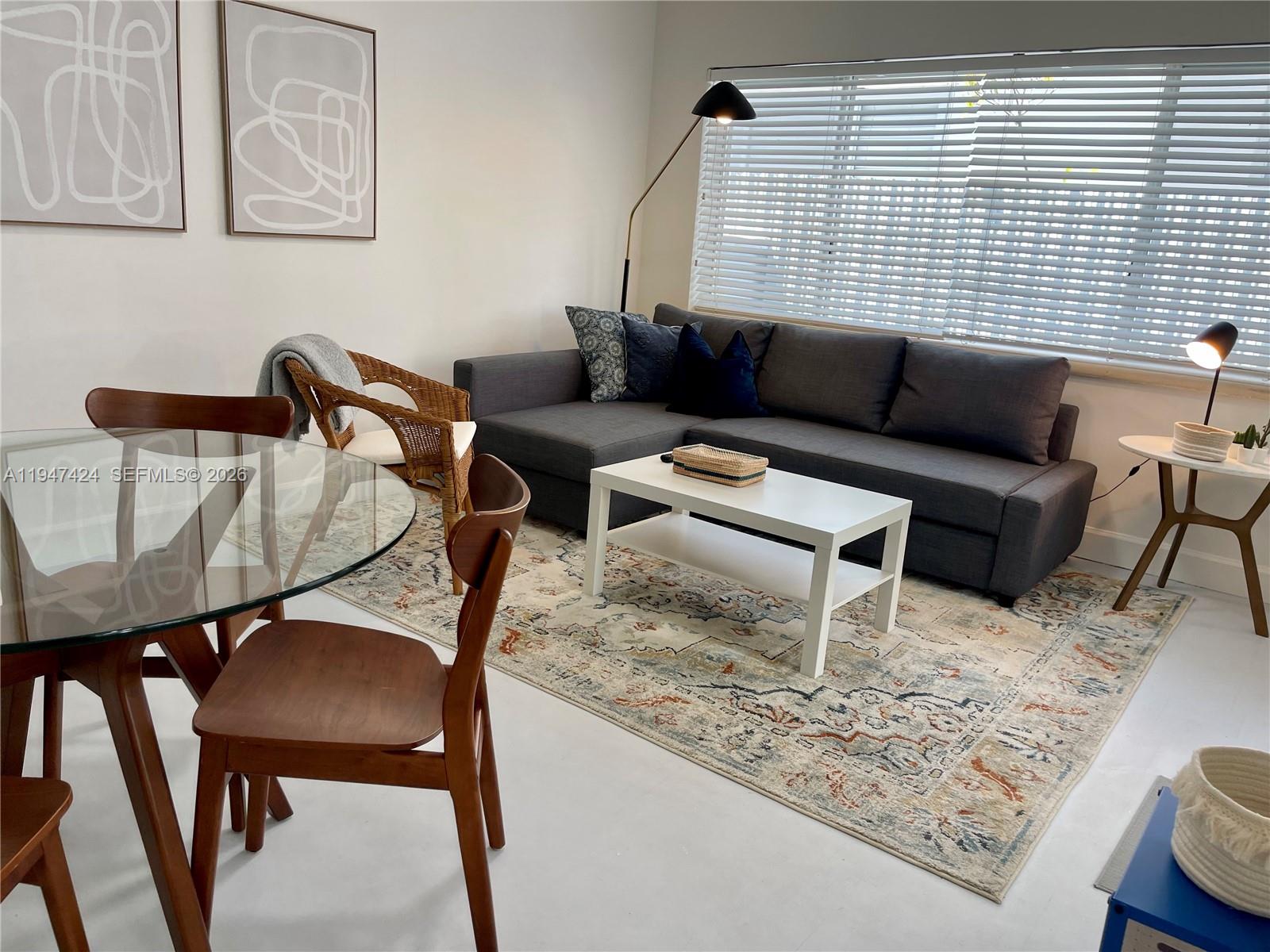 8036 Harding Avenue, Unit 1 Miami Beach, FL 33141 - Photo 31 of 33 a living room with furniture and wooden floor