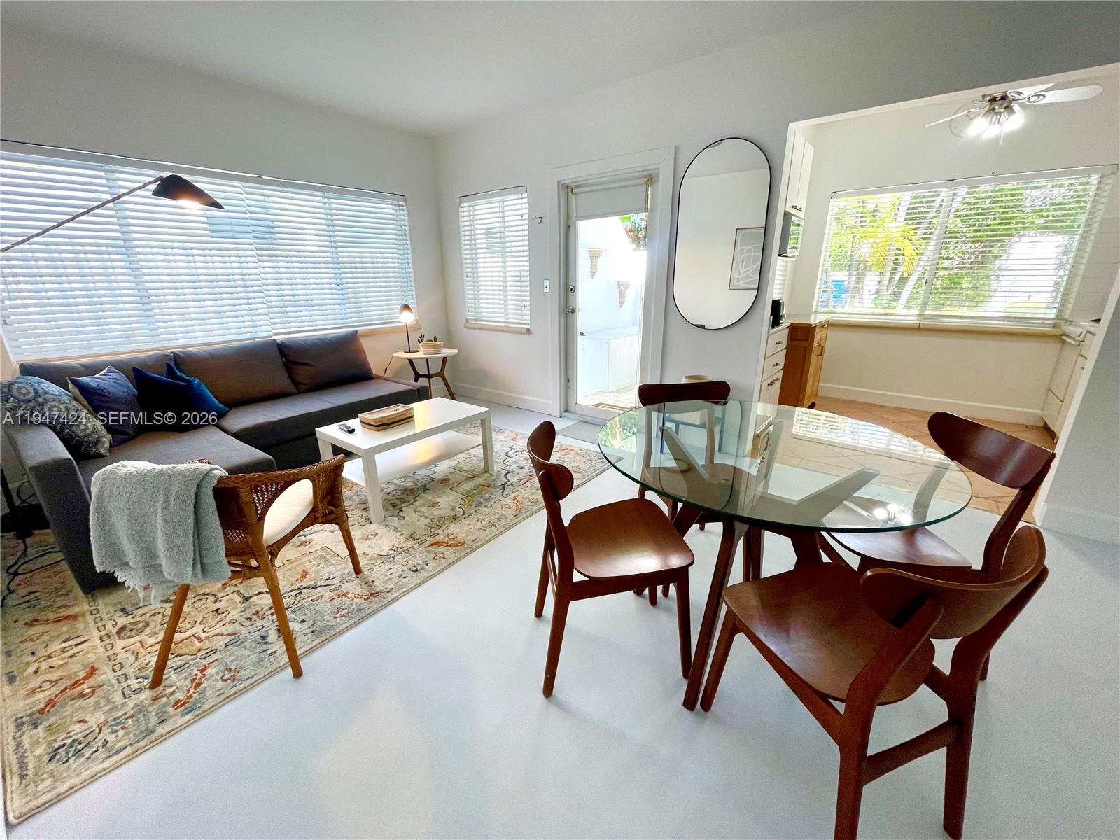 8036 Harding Avenue, Unit 1 Miami Beach, FL 33141 - Photo 4 of 33 a living room with furniture and a window