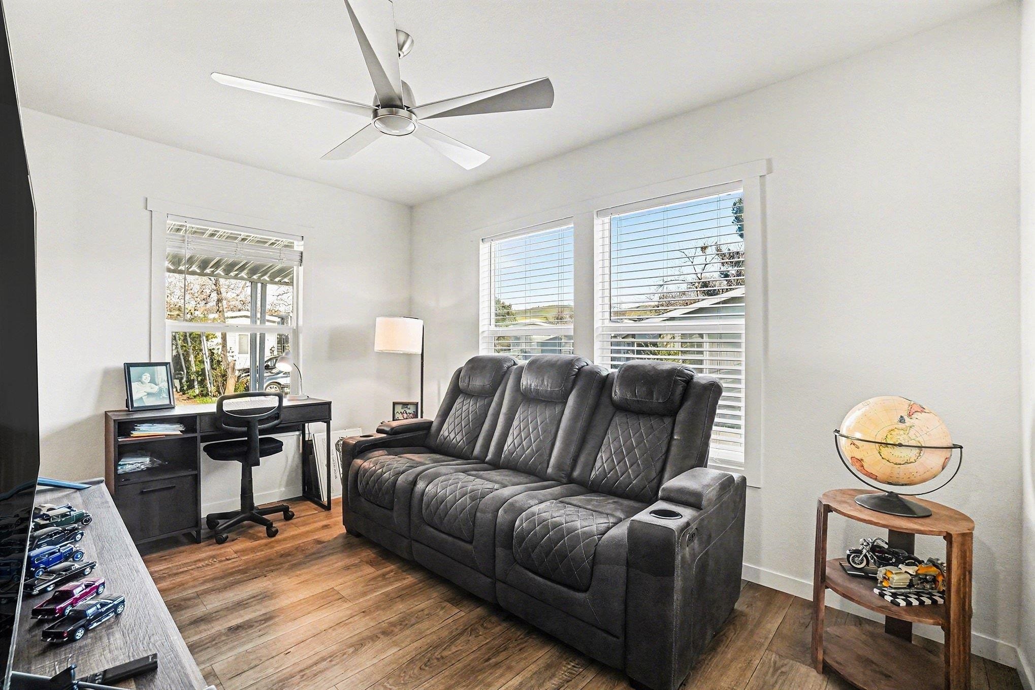 16711 Marsh Creek Road, Unit 150 Clayton, CA 94517 - Photo 12 of 19 a living room with furniture a rug and a chandelier