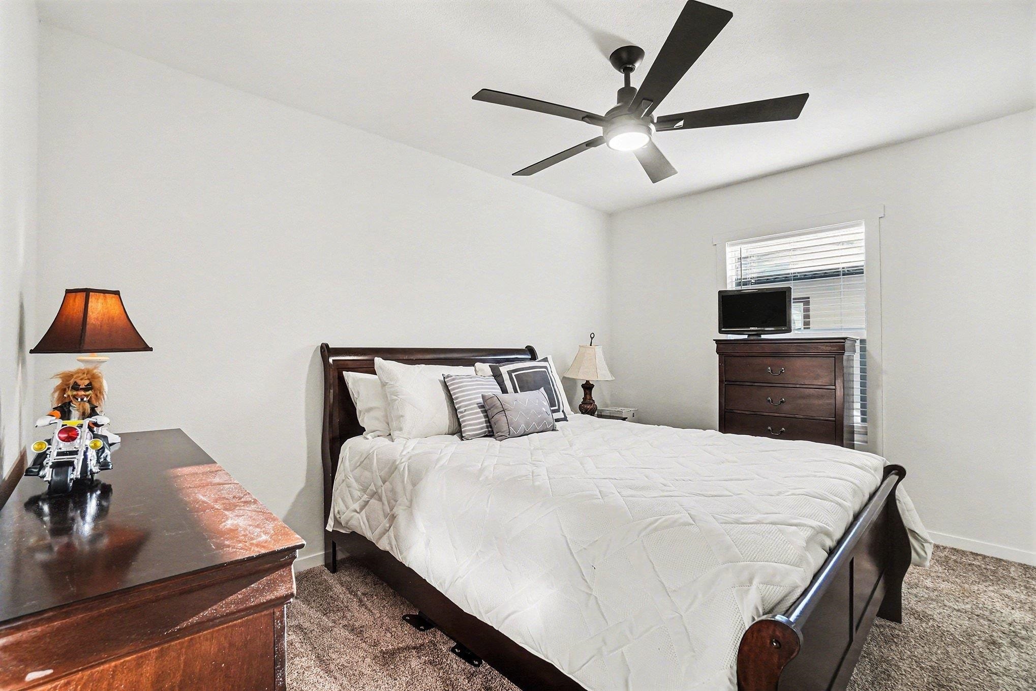 16711 Marsh Creek Road, Unit 150 Clayton, CA 94517 - Photo 17 of 19 a bedroom with a bed and a dresser in it