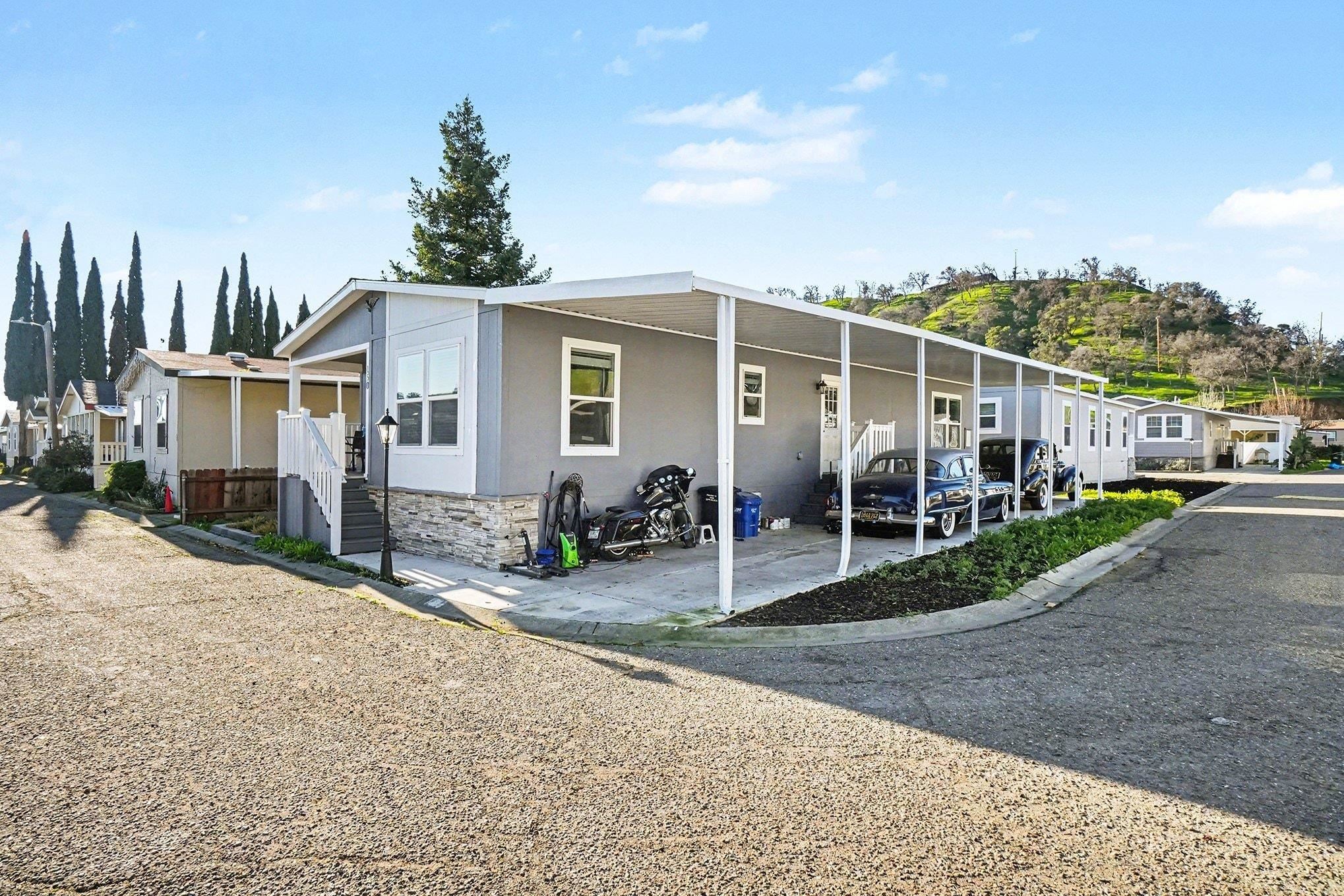 16711 Marsh Creek Road, Unit 150 Clayton, CA 94517 - Photo 19 of 19 a view of a house with backyard porch and sitting area