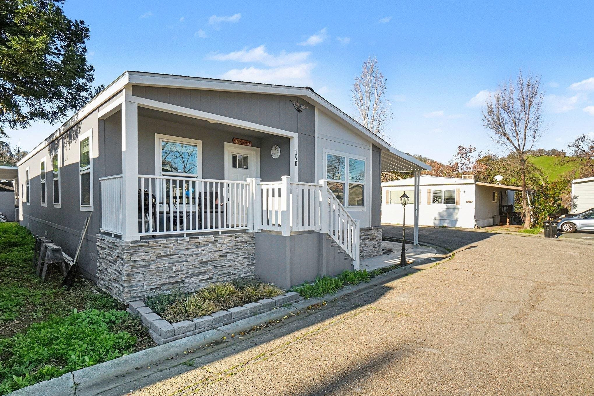 16711 Marsh Creek Road, Unit 150 Clayton, CA 94517 - Photo 4 of 19 a front view of a house with garden