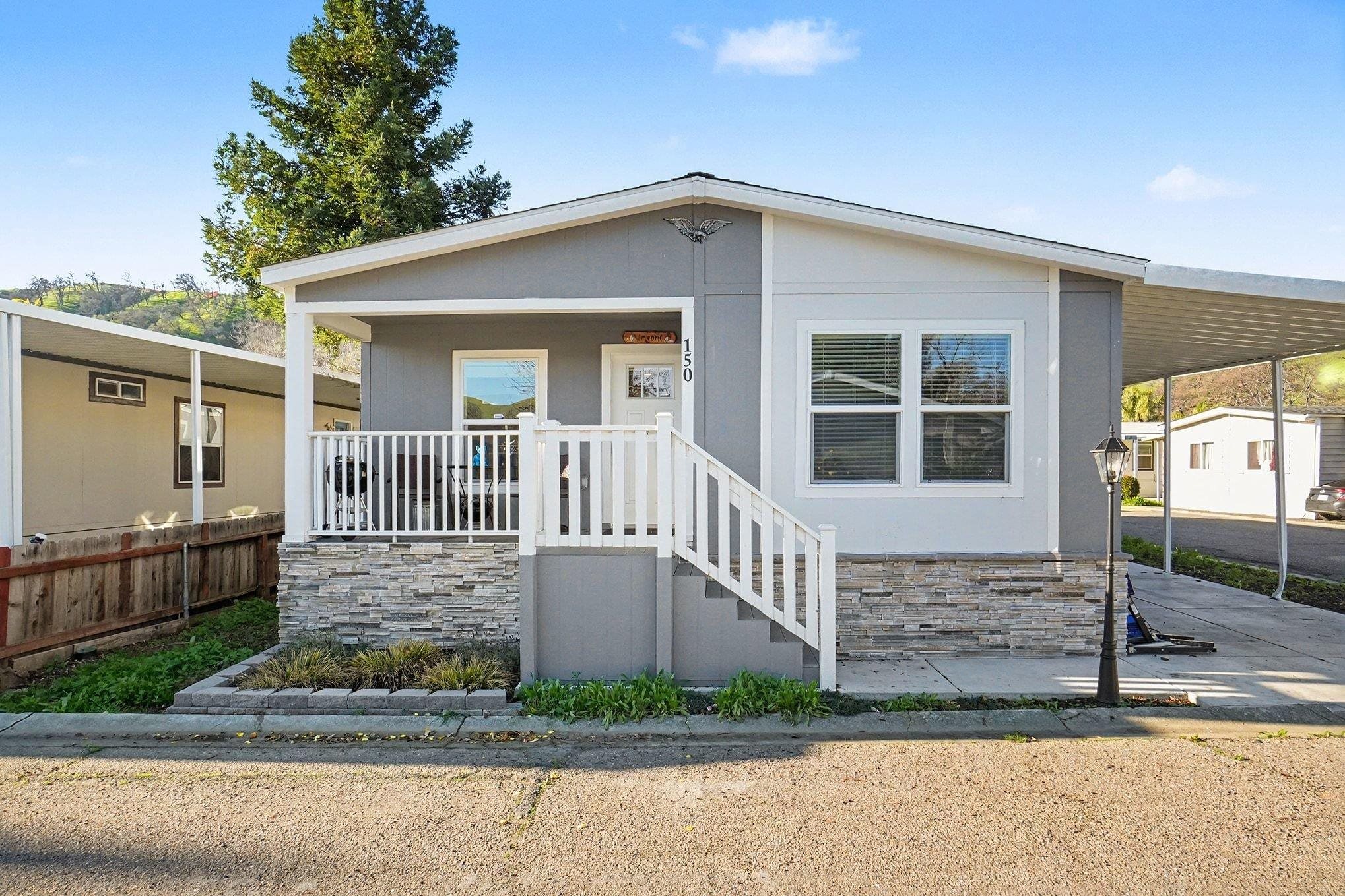 16711 Marsh Creek Road, Unit 150 Clayton, CA 94517 - Photo 5 of 19 a view of a house with a small yard and wooden fence