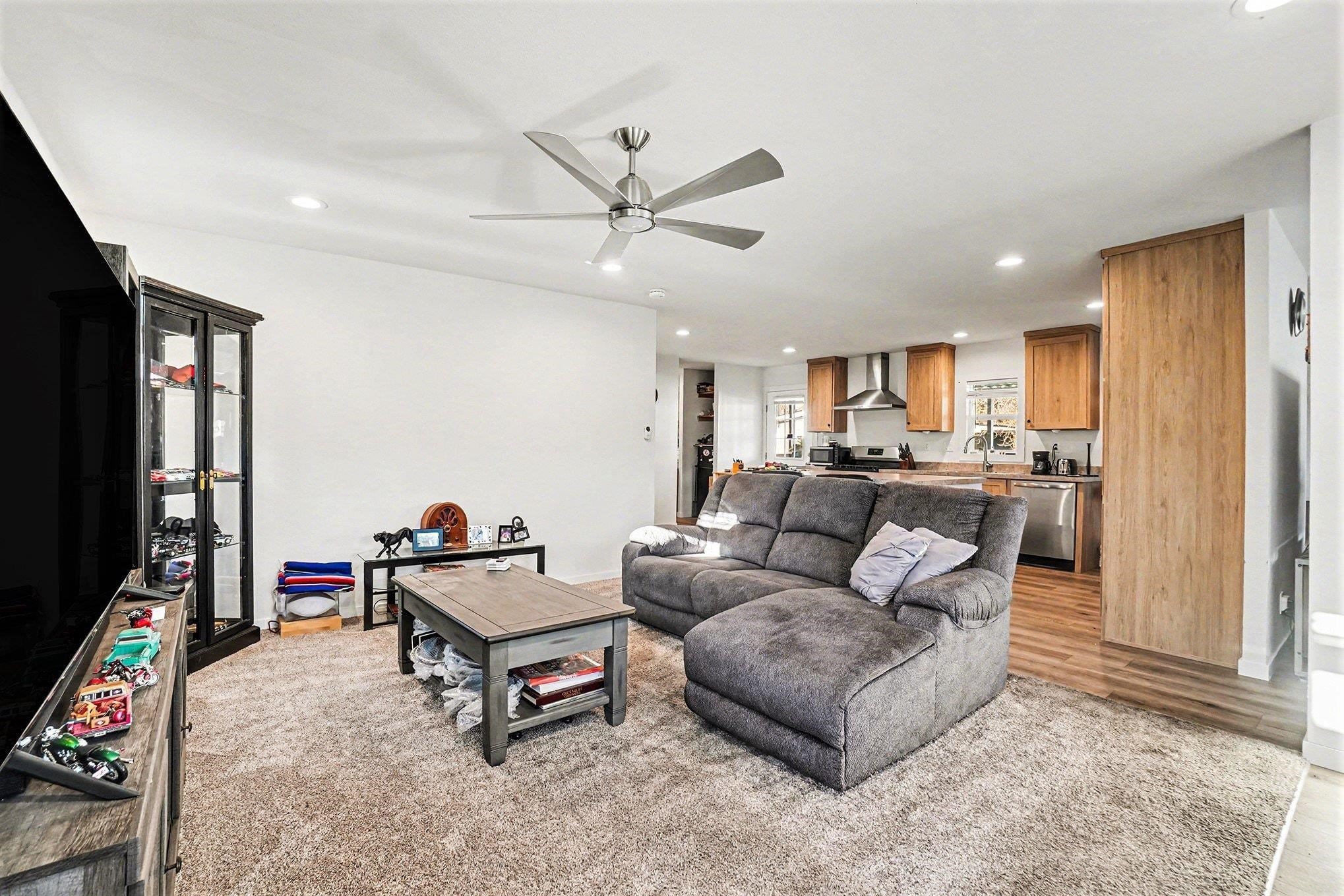 16711 Marsh Creek Road, Unit 150 Clayton, CA 94517 - Photo 8 of 19 a living room with furniture and a flat screen tv