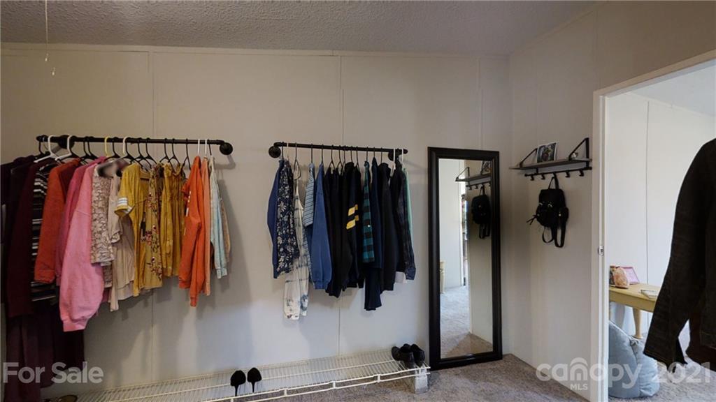 5375 Hope Road Vale, NC 28168 - Photo 7 of 10 a view of walk in closet with clothes and shoes