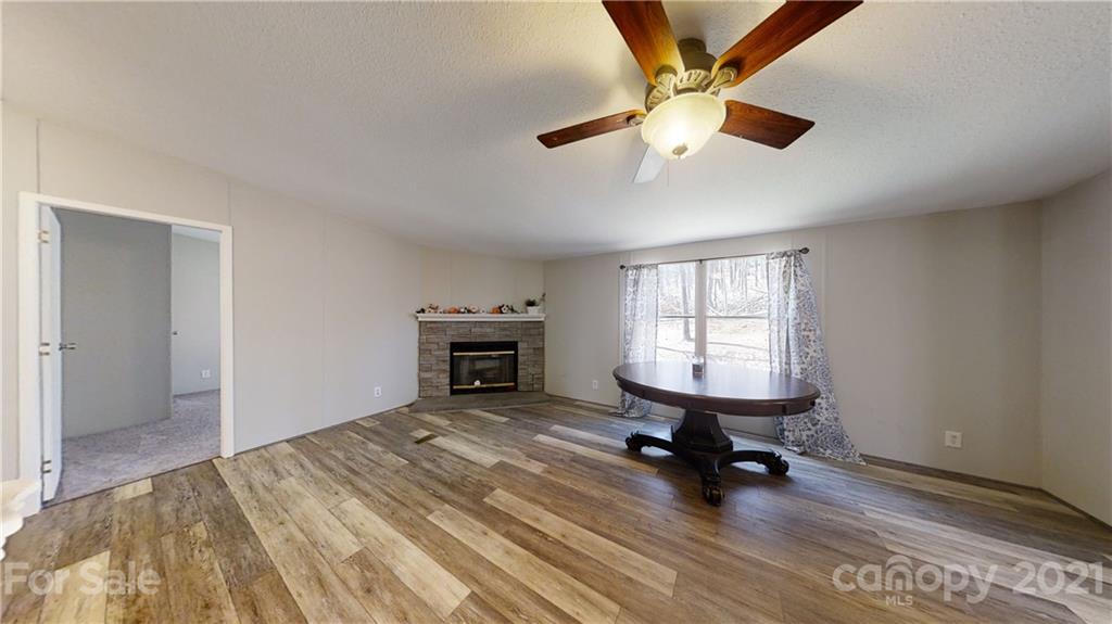 5375 Hope Road Vale, NC 28168 - Photo 8 of 10 a view of a livingroom with a ceiling fan and a window