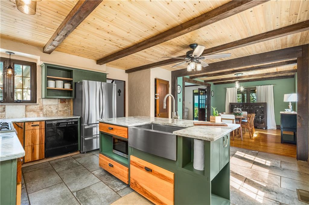 200 Stone Quarry Road Monaca, PA 15061 - Photo 12 of 45 a kitchen with stainless steel appliances granite countertop a sink and a refrigerator