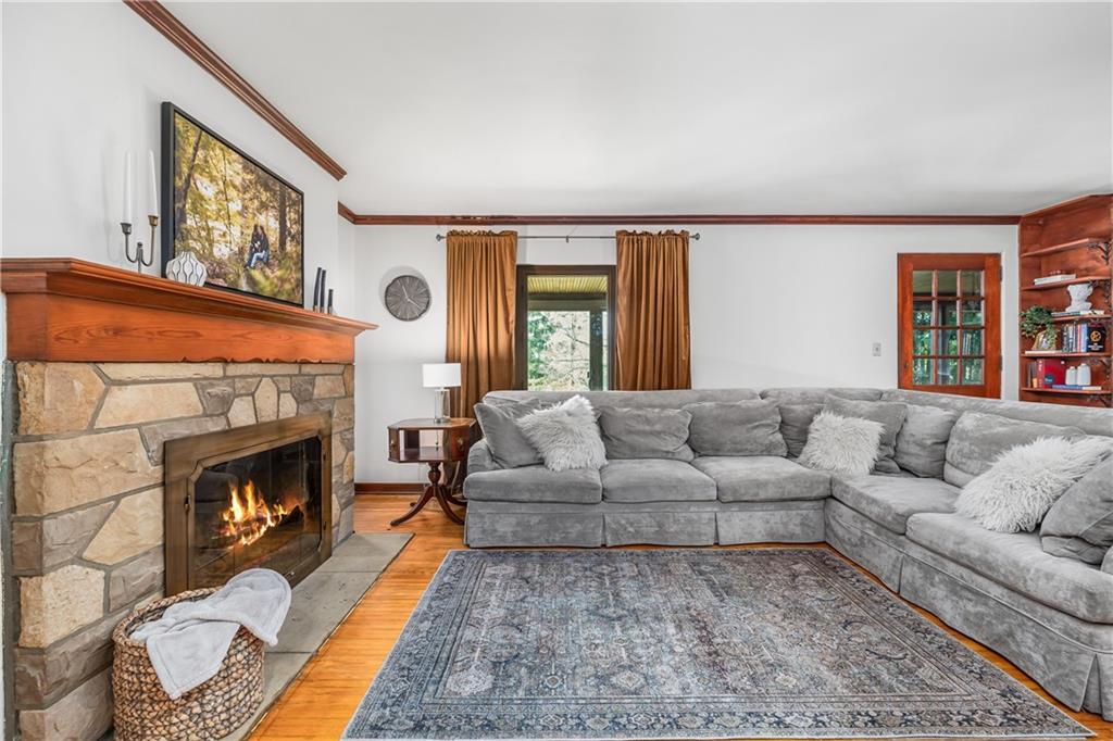 200 Stone Quarry Road Monaca, PA 15061 - Photo 15 of 45 a living room with furniture and a fireplace
