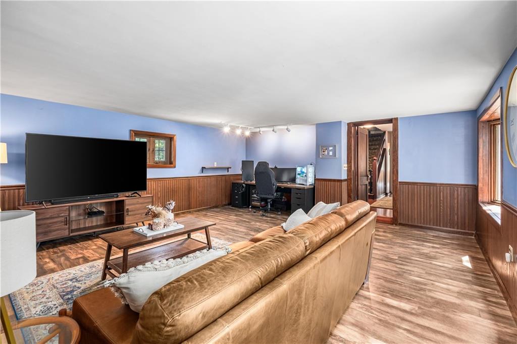 200 Stone Quarry Road Monaca, PA 15061 - Photo 16 of 45 a living room with furniture and a flat screen tv