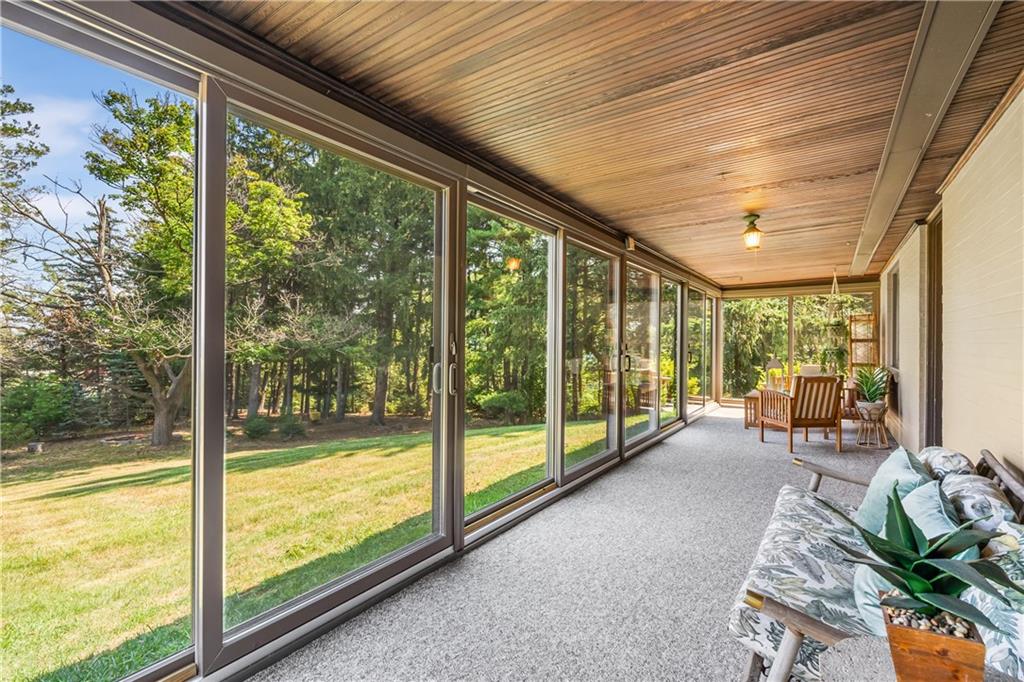 200 Stone Quarry Road Monaca, PA 15061 - Photo 18 of 45 a living room with large windows and furniture