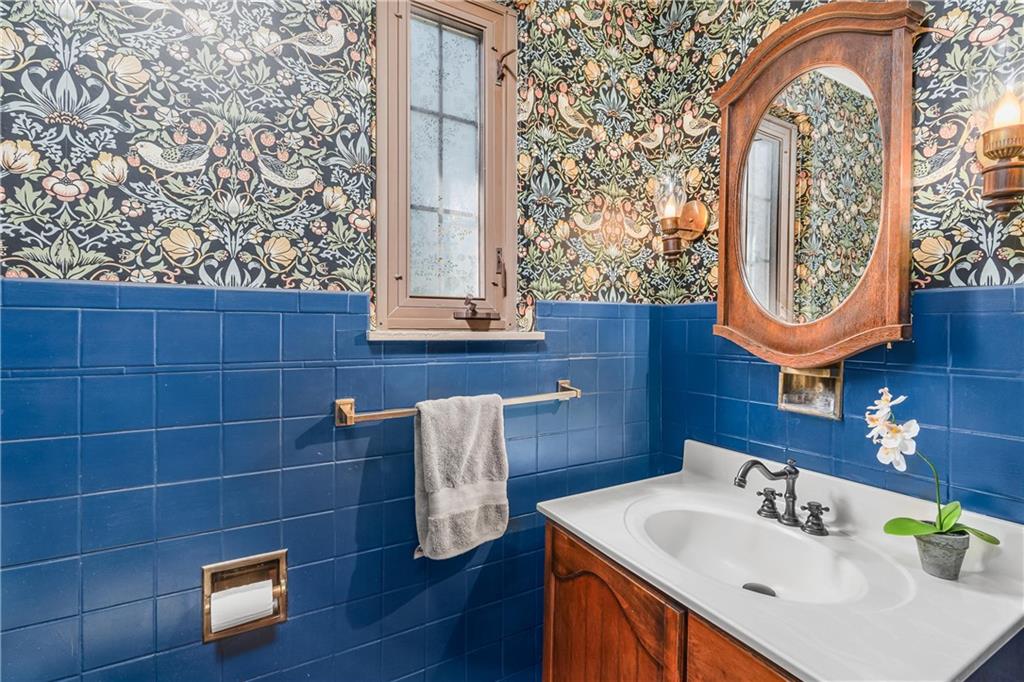 200 Stone Quarry Road Monaca, PA 15061 - Photo 19 of 45 a bathroom with a sink and a mirror