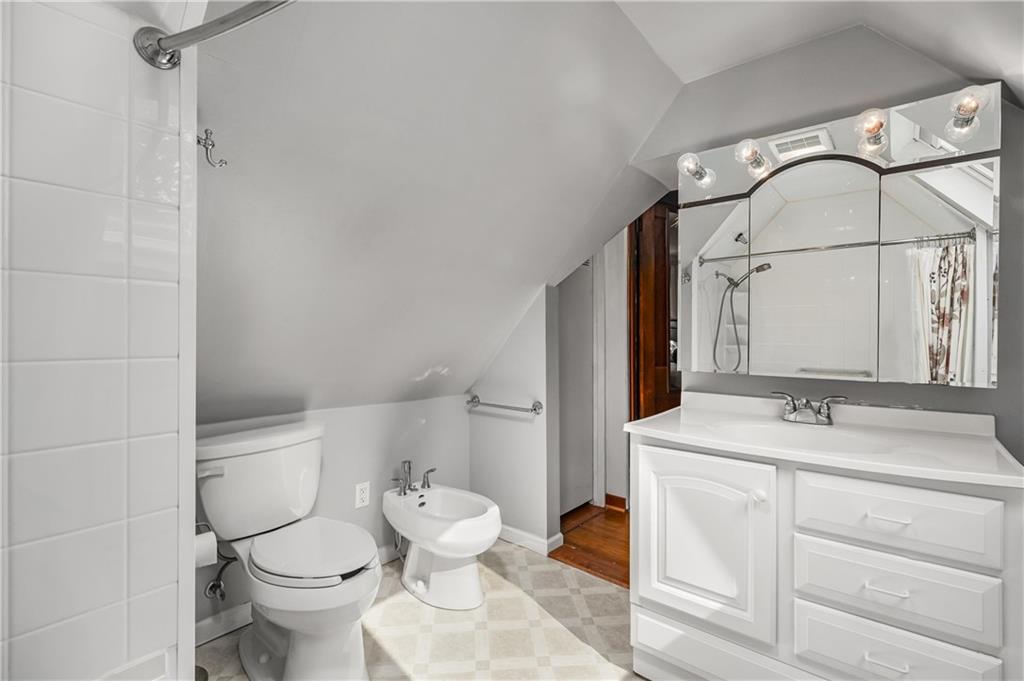 200 Stone Quarry Road Monaca, PA 15061 - Photo 23 of 45 a bathroom with a sink a toilet and a mirror