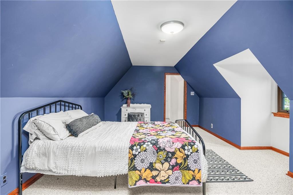 200 Stone Quarry Road Monaca, PA 15061 - Photo 24 of 45 a bedroom with a bed and a lamp