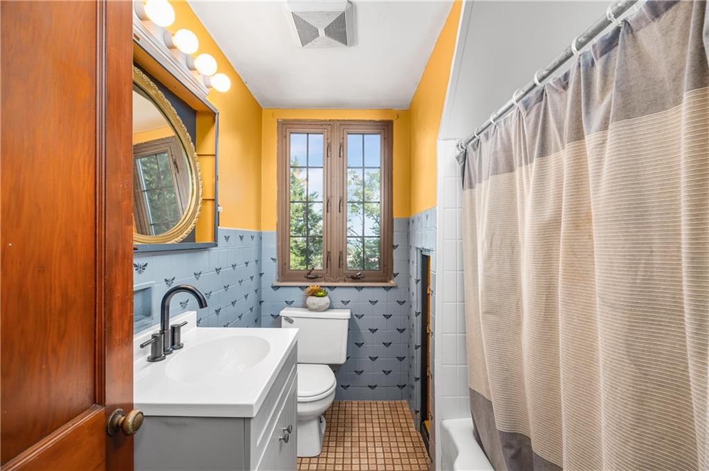 200 Stone Quarry Road Monaca, PA 15061 - Photo 27 of 45 a bathroom with a sink a toilet and a window