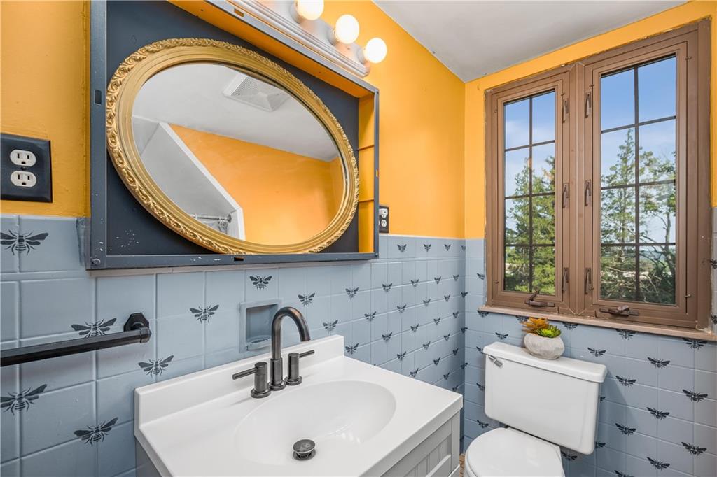 200 Stone Quarry Road Monaca, PA 15061 - Photo 28 of 45 a bathroom with a sink a toilet and a mirror