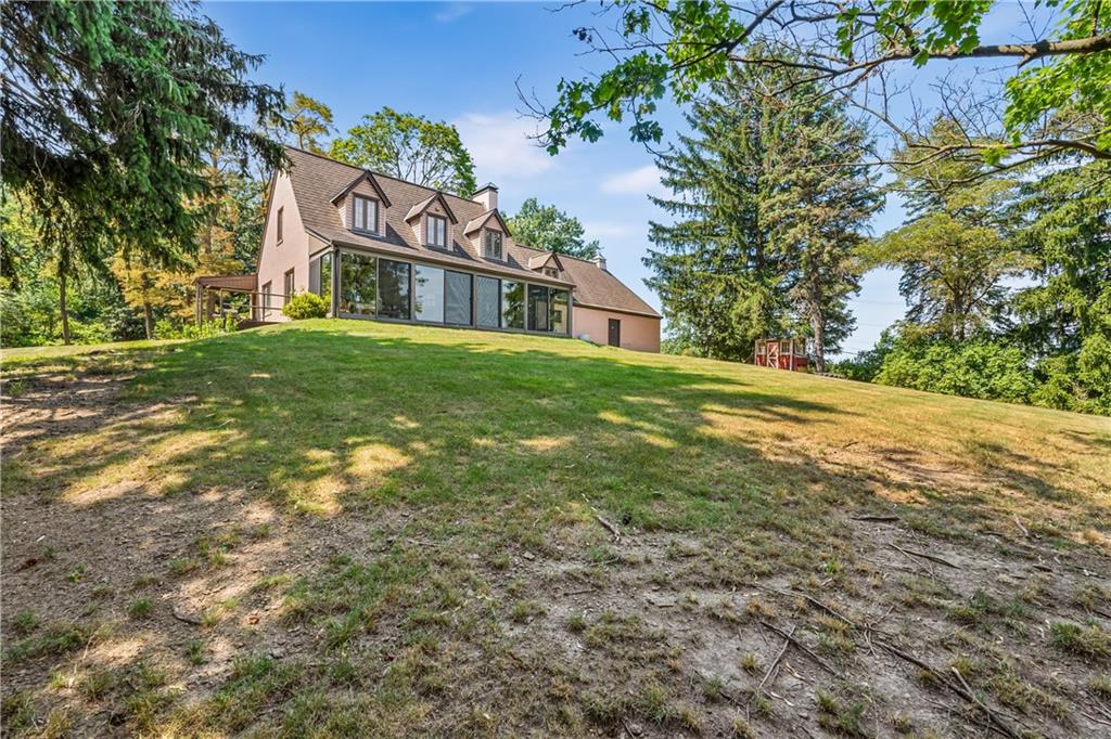 200 Stone Quarry Road Monaca, PA 15061 - Photo 37 of 45 a view of a house with a big yard and large trees