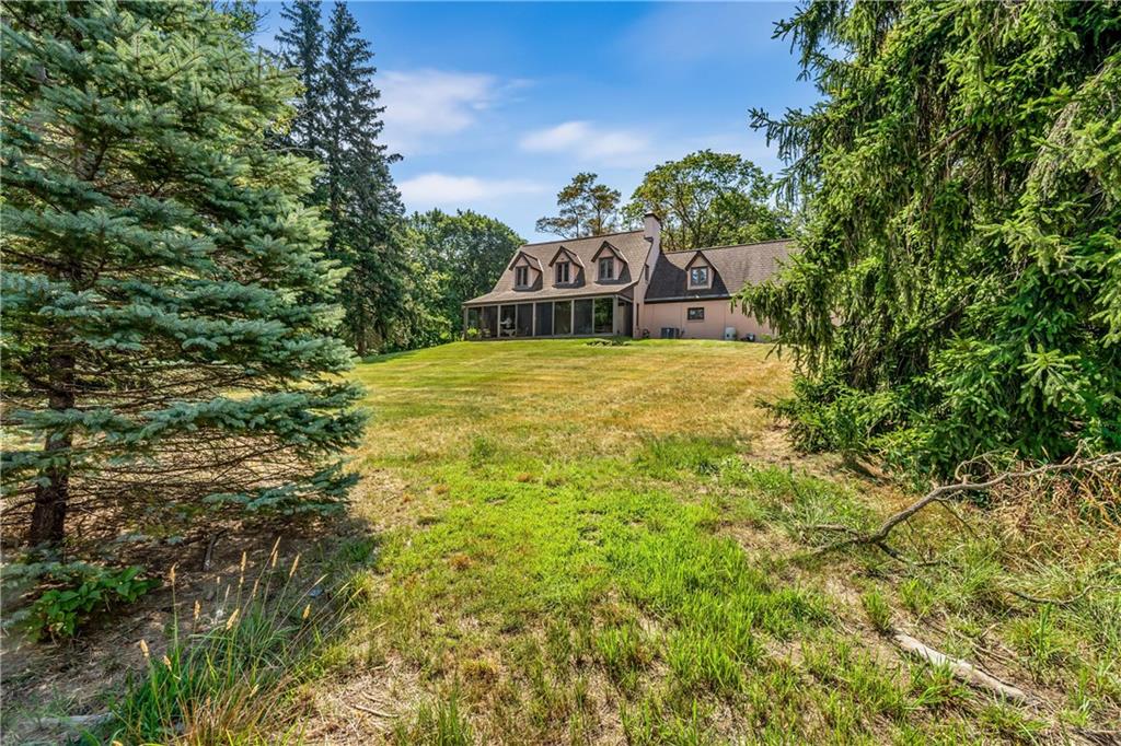 200 Stone Quarry Road Monaca, PA 15061 - Photo 40 of 45 a tall yellow house in middle of the forest