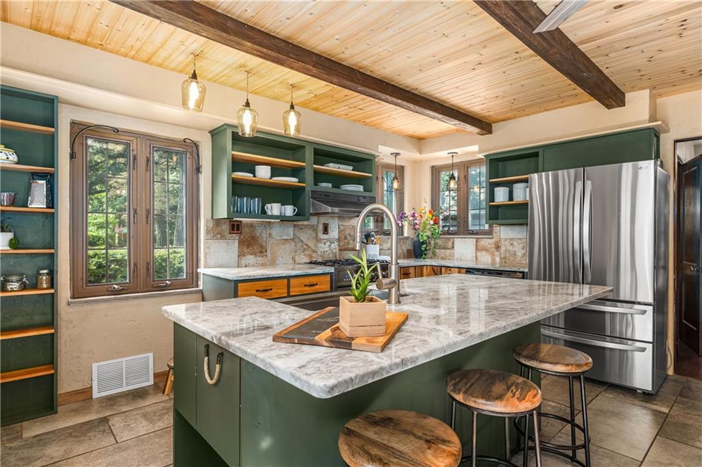 200 Stone Quarry Road Monaca, PA 15061 - Photo 7 of 45 a kitchen with a table chairs and refrigerator