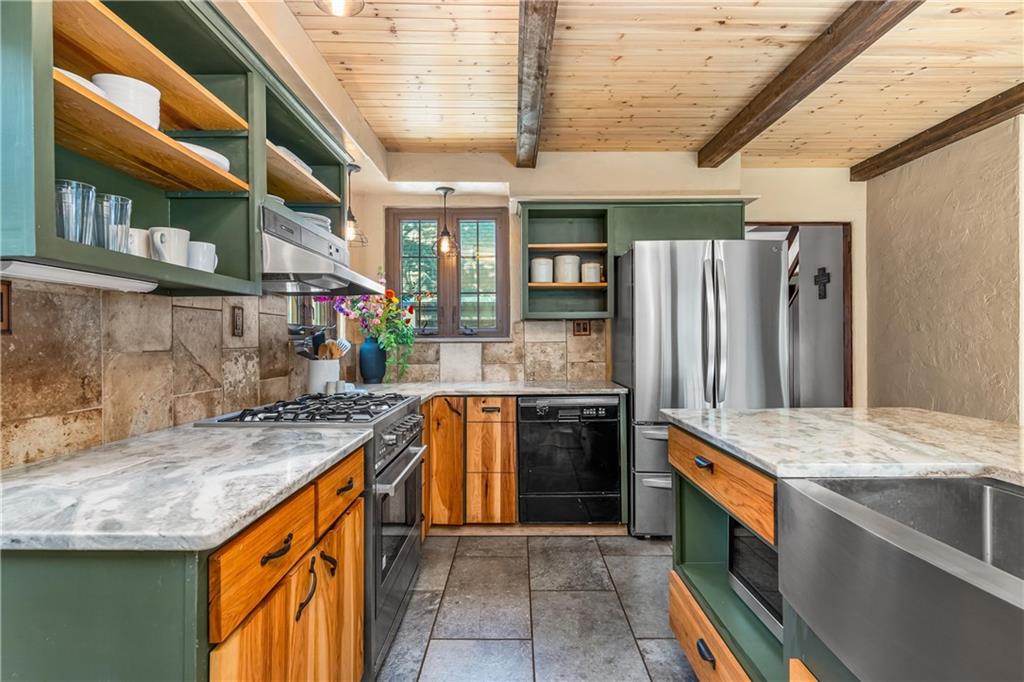 200 Stone Quarry Road Monaca, PA 15061 - Photo 8 of 45 a kitchen with stainless steel appliances granite countertop a sink stove and refrigerator