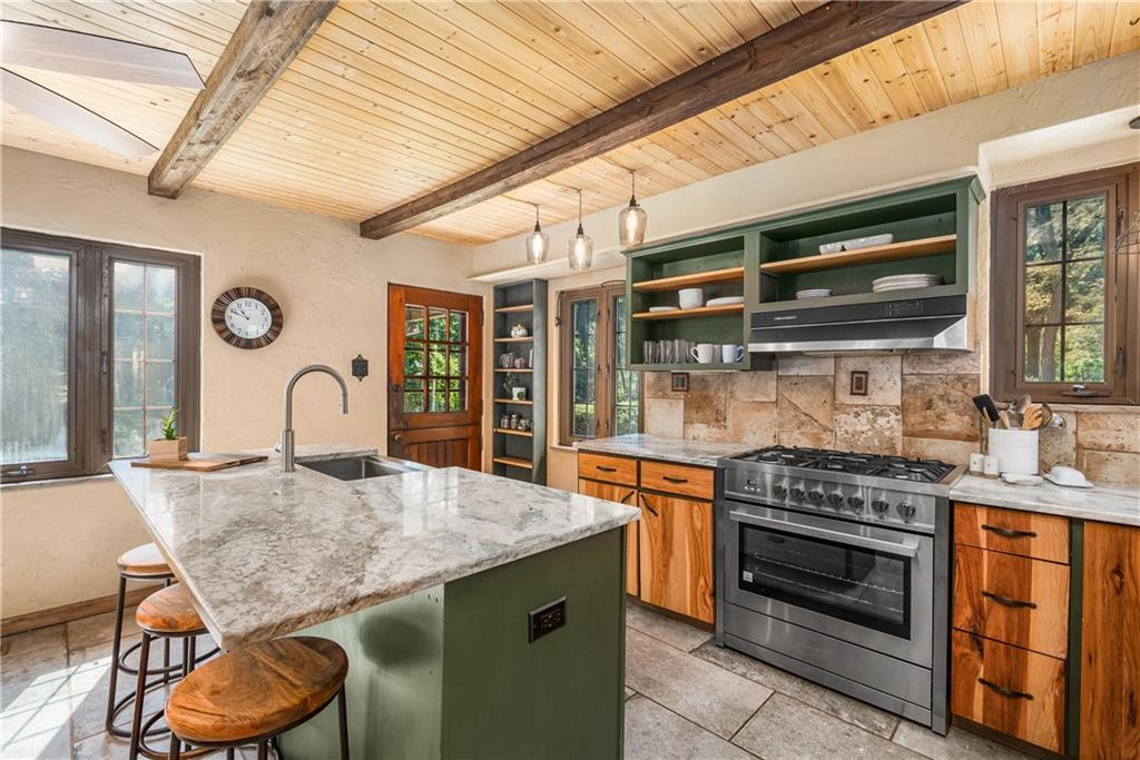 200 Stone Quarry Road Monaca, PA 15061 - Photo 9 of 45 a kitchen with granite countertop a stove and cabinets