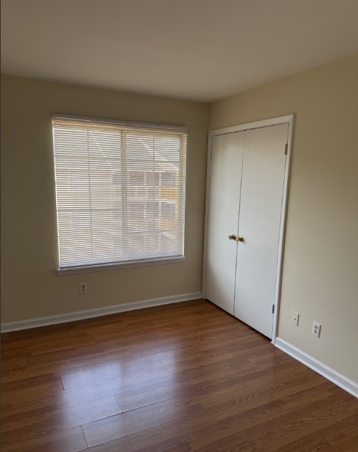 220 Elm Street, Unit 533 Clemson, SC 29631 - Photo 8 of 10 Natural light illuminates this bedroom with rich hardwood floors and a spacious closet.