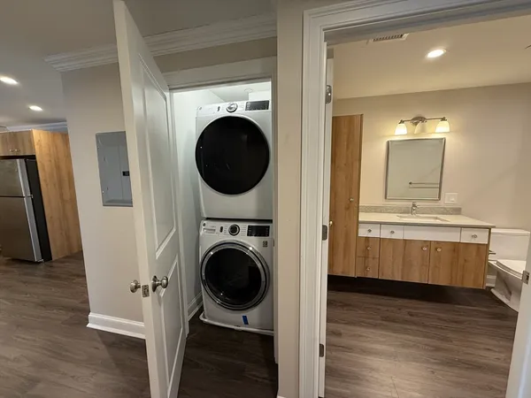 a view of a hallway with washer and dryer