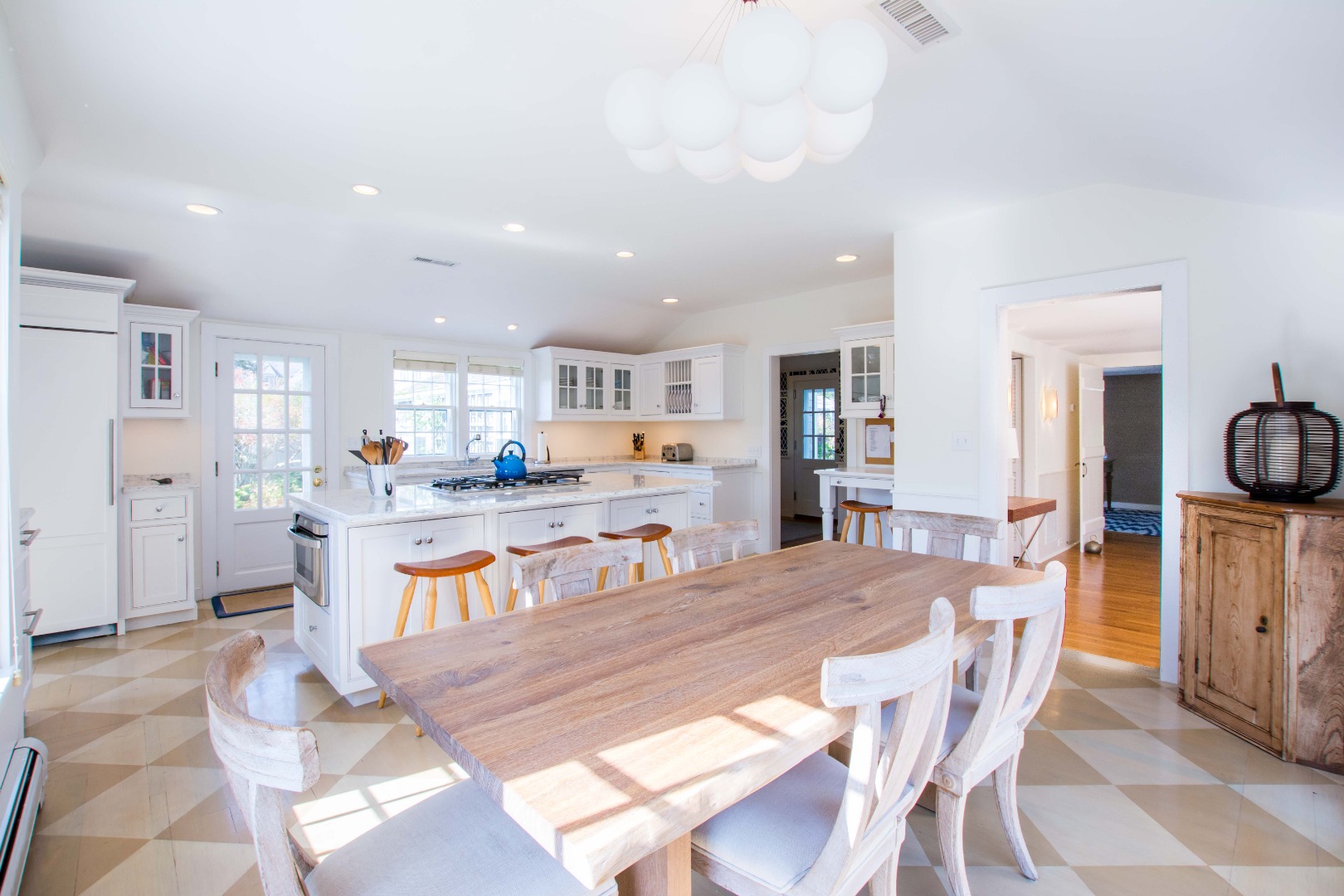 60 Cliff Road Nantucket, MA 02554 - Photo 18 of 54 a living room with dining table and wooden floor