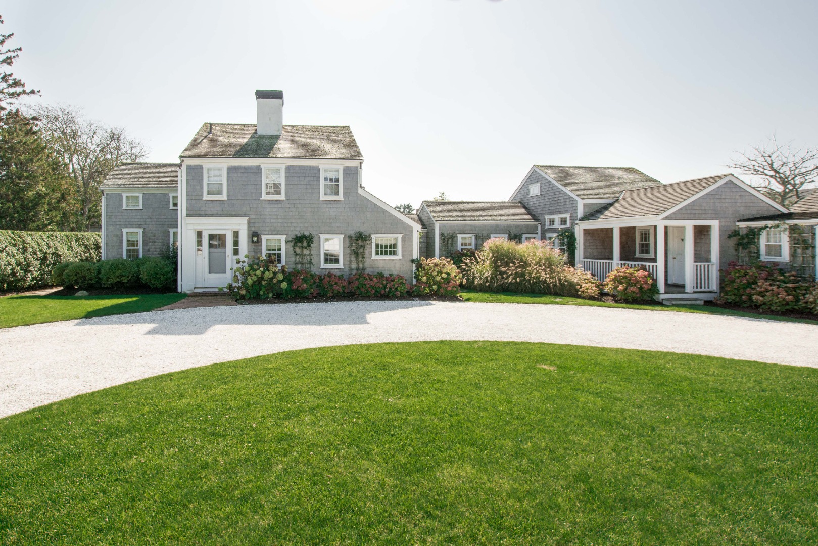 60 Cliff Road Nantucket, MA 02554 - Photo 2 of 54 a front view of a house with a yard