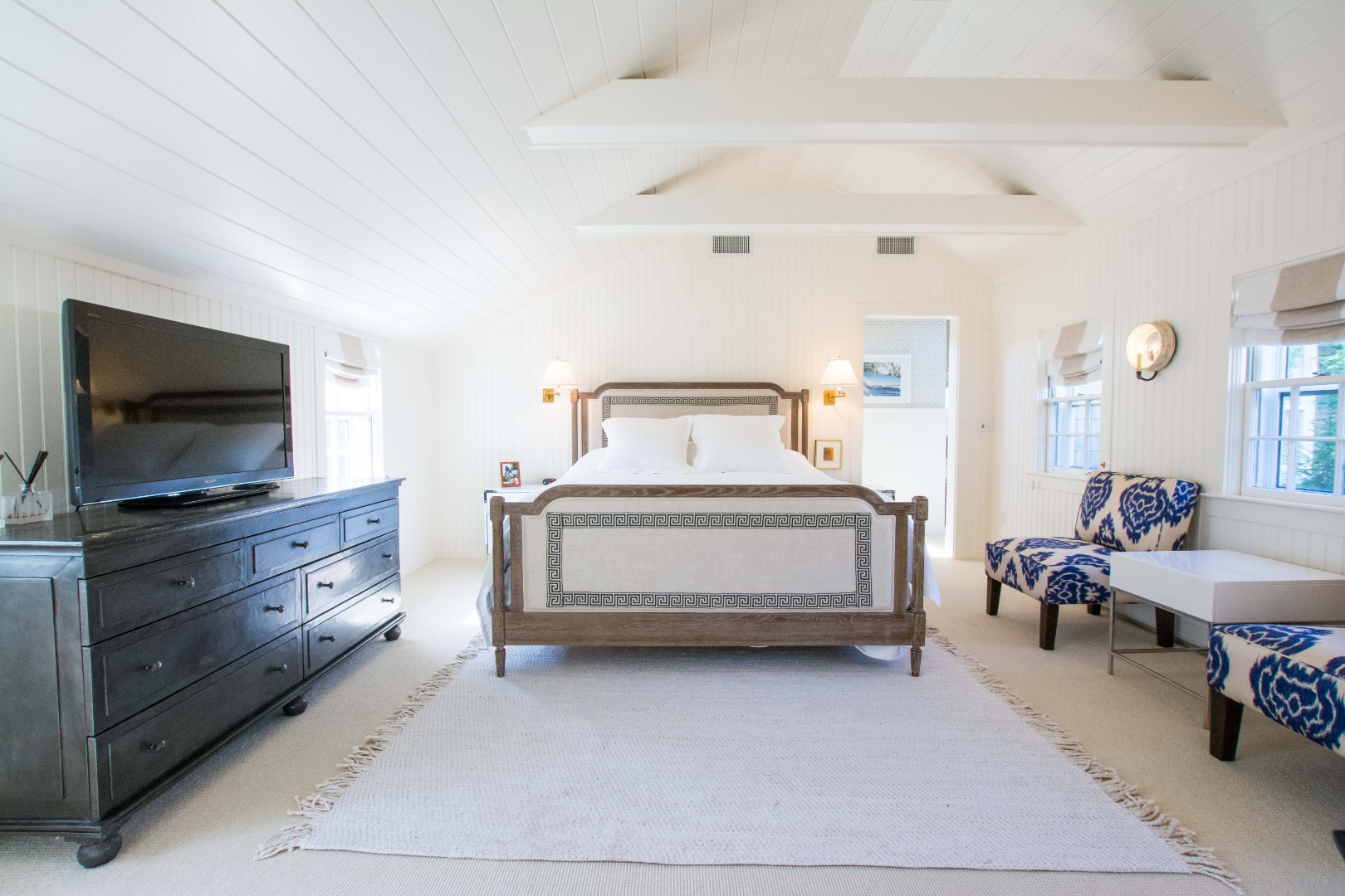 60 Cliff Road Nantucket, MA 02554 - Photo 28 of 54 a bedroom with a bed and flat screen tv