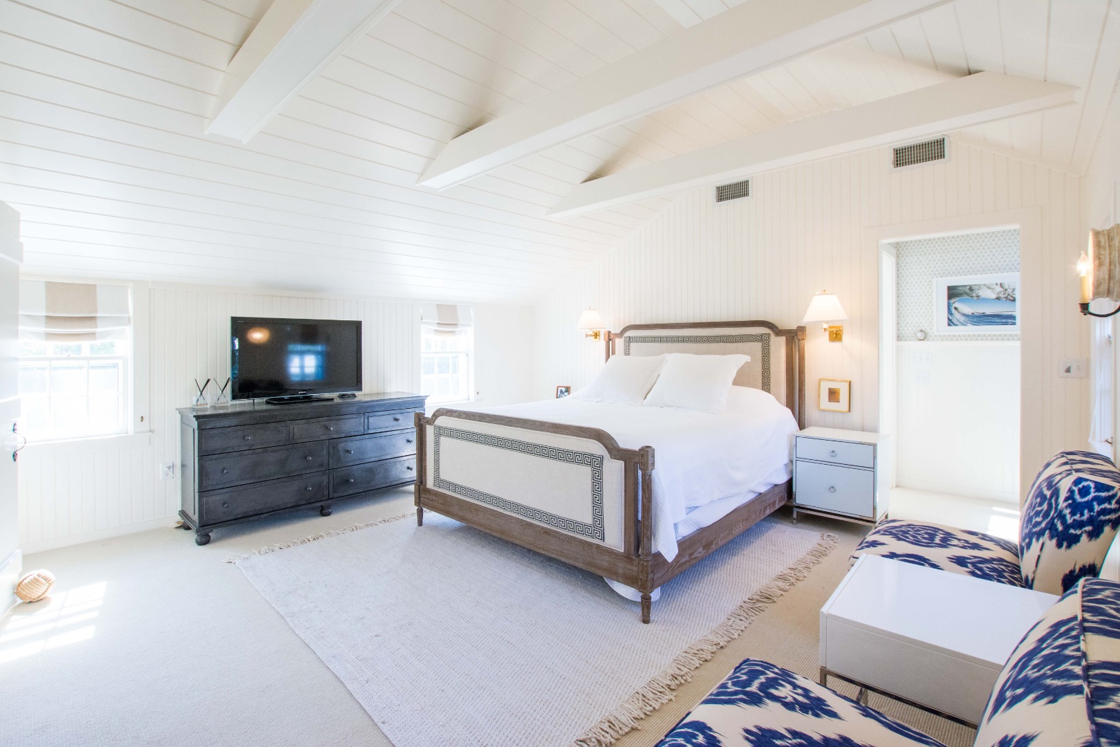 60 Cliff Road Nantucket, MA 02554 - Photo 29 of 54 a bedroom with a bed and a flat screen tv