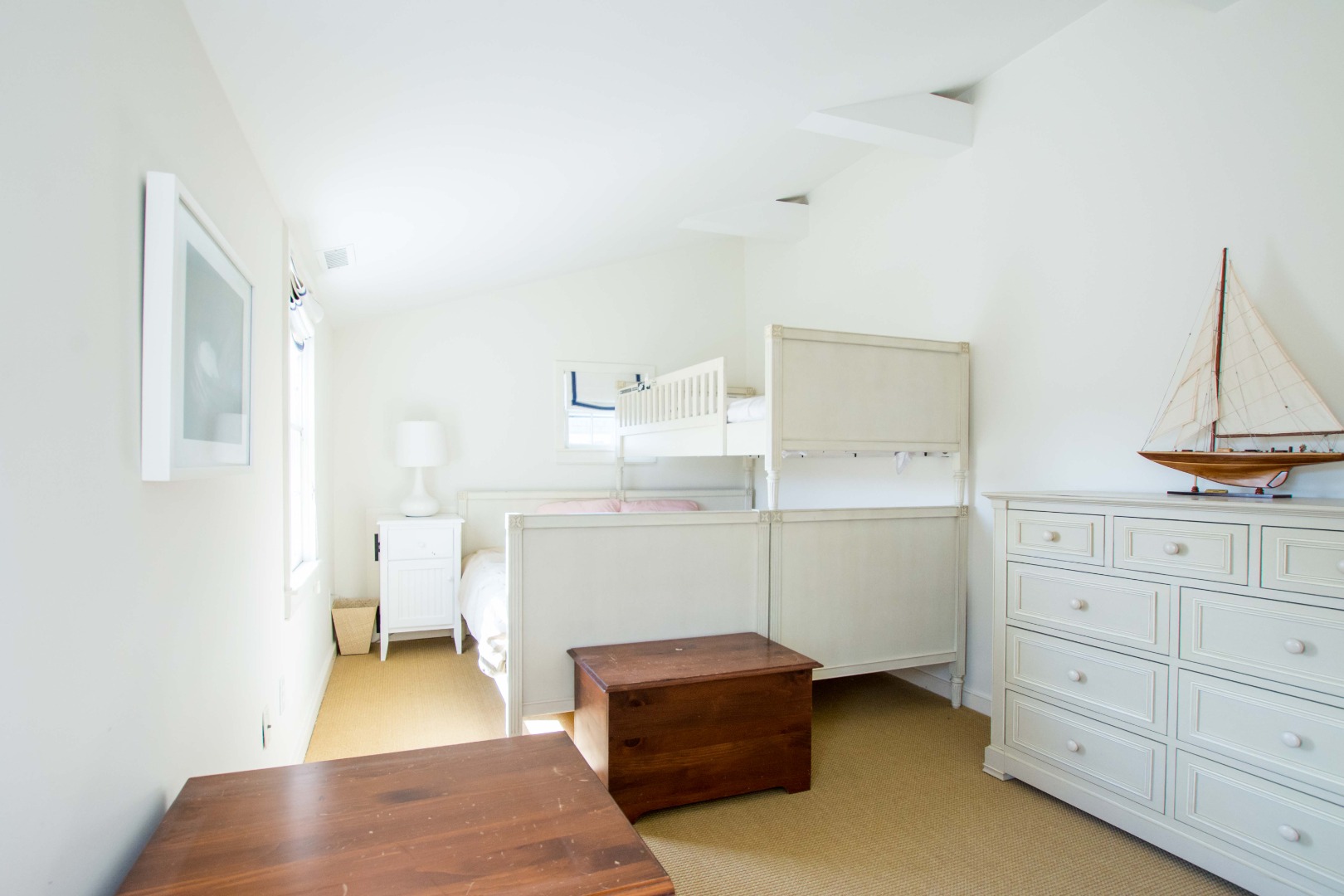 60 Cliff Road Nantucket, MA 02554 - Photo 44 of 54 a room with a dresser and a mirror