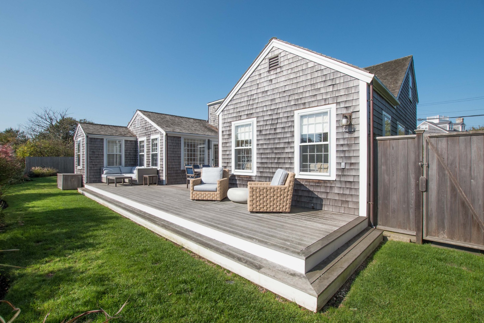 60 Cliff Road Nantucket, MA 02554 - Photo 9 of 54 a view of a house with backyard and porch