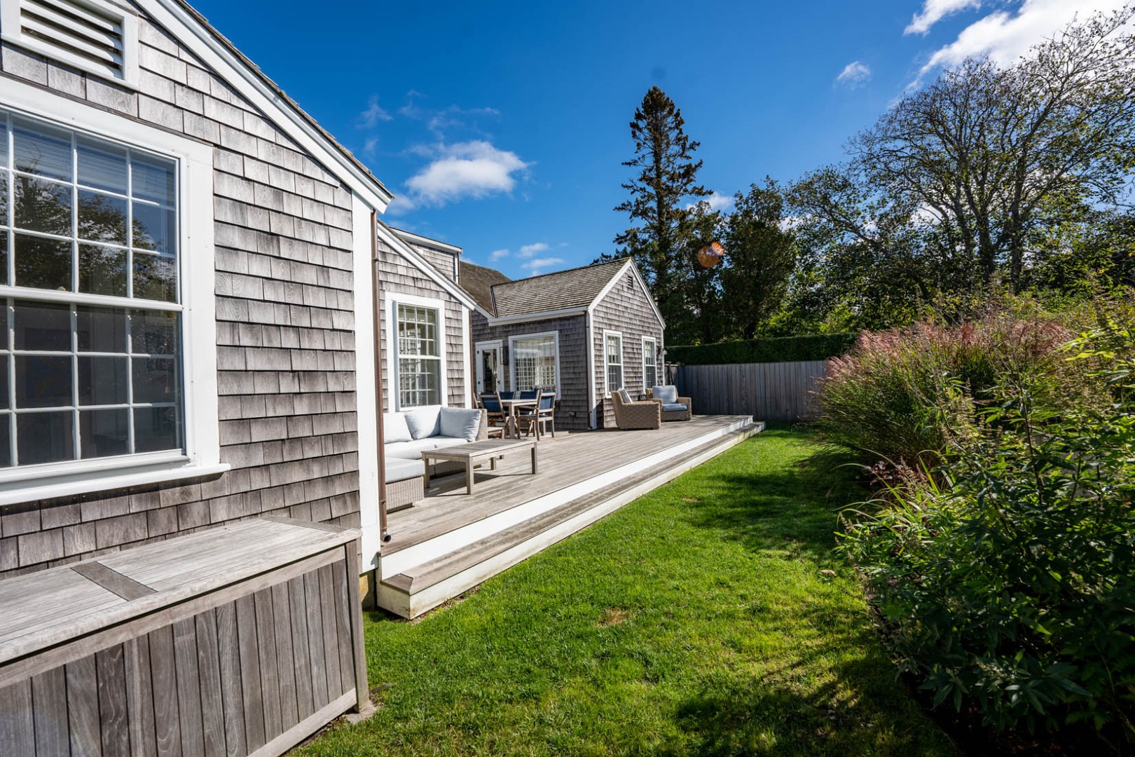 60 Cliff Road Nantucket, MA 02554 - Photo 10 of 54 a view of a house with backyard and sitting area